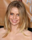 Kelli Garner's long hairstyle with strands that curl around her shoulders