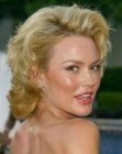 Kelly Carlson's medium length vintage inspired hairstyle with curls