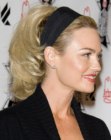 Kelly Carlson keeping her hair up and back with hair band