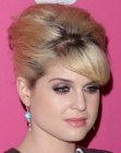 Kelly Osbourne with her hair styled up for a 1960s look