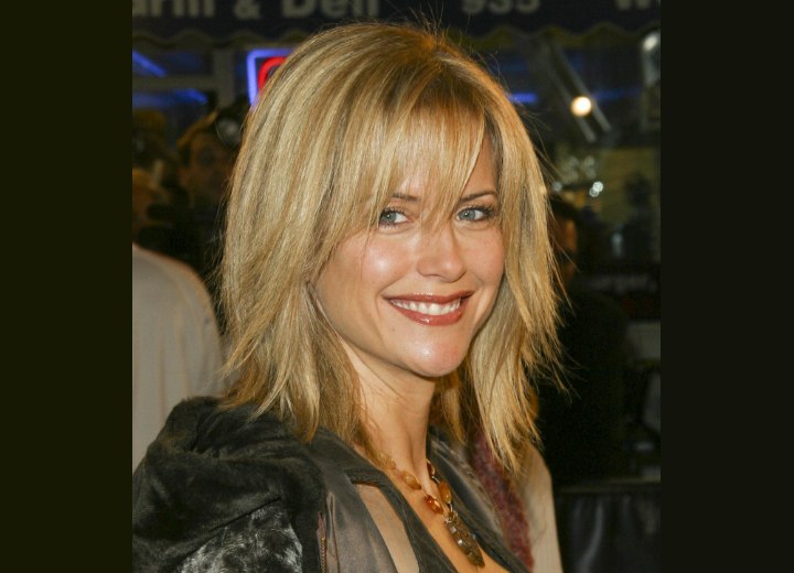 Kelly Preston with razor cut hair