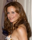 Kelly Preston's timeless long hairstyle with curls