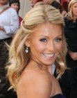 Kelly Ripa's hair fastened in the back