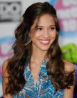 Kelsey Chow with her long brown hair styled into big waves