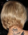 Kerry Katona's hair cut in a bob with an extra short layered neck section