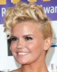 Kerry Katona rocking a very short haircut with curled top hair