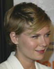Kirsten Dunst's short side parted hair with diagonal styling