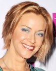 Kristanna Loken wearing her blonde hair with lowlights in a short graduated bob