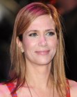 Kristen Wigg's simple long straight hair with an off-center part