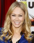 Kym Johnson's sporty look with long curled hair