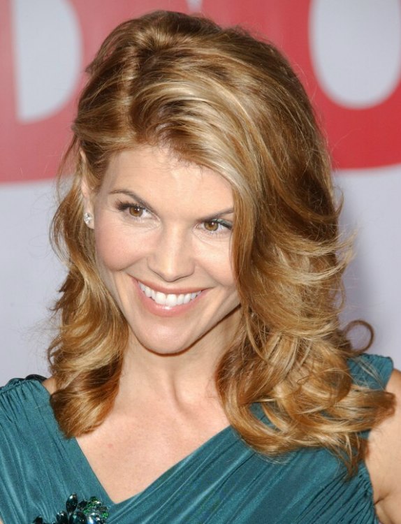Lori Loughlin's hair with a wave that curves around her eye