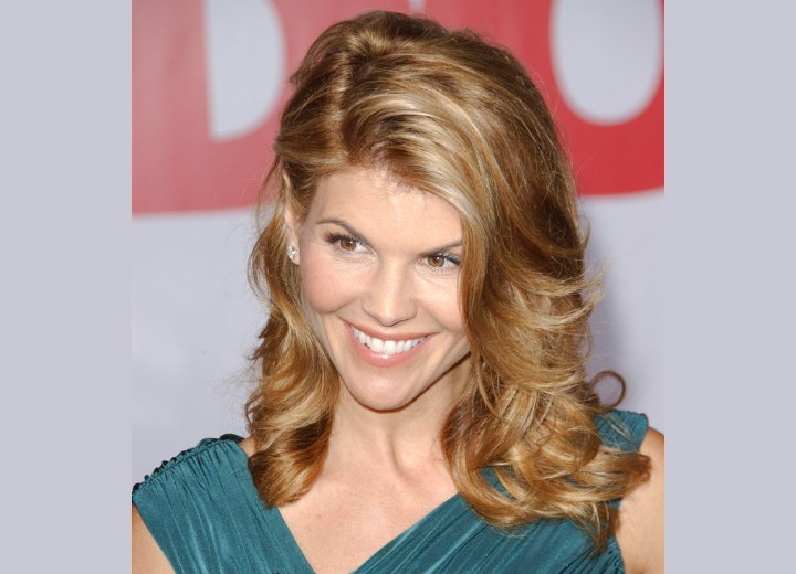 Lori Loughlin's long hairstyle with waves and curls