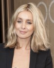 Louise Redknapp sporting a long bob with parting in the middle