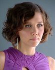 Maggie Gyllenhaal with short hair and 1920s finger waves