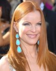 Marcia Cross wearing her red hair long and sleek with slight tapering