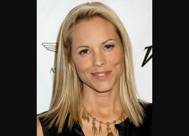 Maria Bello with shoulder grazing blonde hair