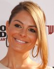 Maria Menounos with her hair pulled back into a ponytail