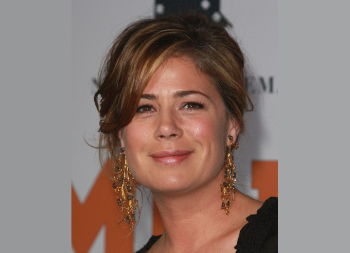 Maura Tierney with her hair styled up