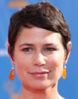 Maura Tierney with her hair in  a pixie with sideswept bangs