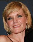 Maura West sporting a short bob with hair that just covers the ears