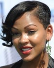 Megan Good's short asymmetrical hairstyle with a shaved side