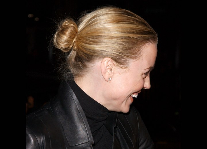 Melissa George with her hair styled in a bun