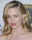 Melissa George sporting a classic medium length hairstyle with a side part