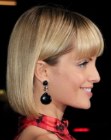 Mena Suvari wearing a blonde neck length bob with just above the eyebrows bangs
