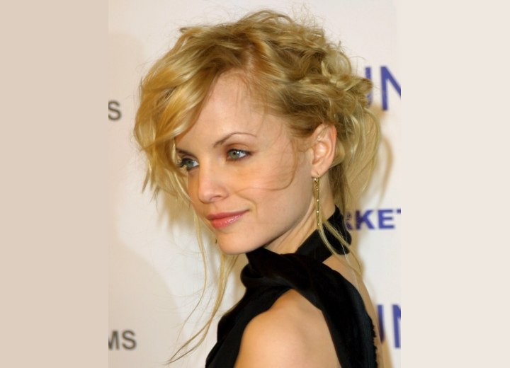 Mena Suvari with her hair in a free style updo