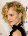Mena Suvari's free style updo with loose hair strands
