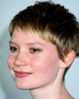 Mia Wasikowska wearing her hair short in a pixie with very short bangs