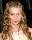Mia Wasikowska with her long hair styled into rippled waves