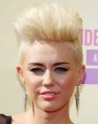 Miley Cyrus wearing her hair very short with shaved neck and sides
