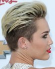 Miley Cyrus rocking very short hair with a buzzed nape and sides