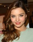 Miranda Kerr's long hair with a straight middle part and curls