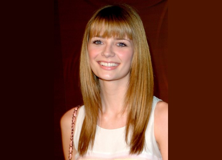 Mischa Barton with her long hair cut to a tapered line around the face