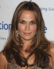 Molly Sims with long dark hair that looks natural