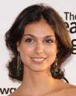 Morena Baccarin's medium length hairstyle with ends that flip up in the neck