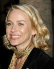 Naomi Watts wearing her blonde hair in a shoulder length bob with spiral curls