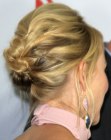 Naomi Watts wearing her hair up and loosely braided