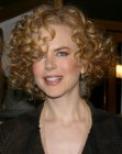 Nicole Kidman wearing her hair short and styled into curls