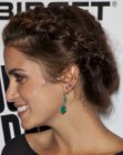 Nikki Reed with her hair in a braided up style