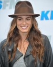 Nikki Reed sporting a hippie look with long hair and a hat