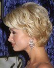 Paris Hilton with her short layered hair styled for volume