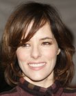 Brunette Parker Posey with medium length layered hair
