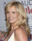 Penny Lancaster with her hair cut into a long style with layers