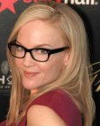 Rachael Harris wearing her hair straight and past shoulder length