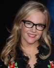 Rachael Harris with her hair in a long style with curled ends