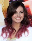 Rebecca Black sporting long purple hair with curling