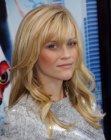 Reese Witherspoon's long layered hair with multiple tones of blonde and bangs